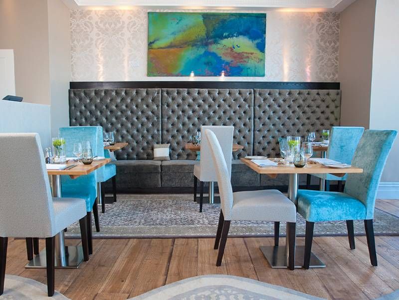 Hand knotted rug in Hotel dining area